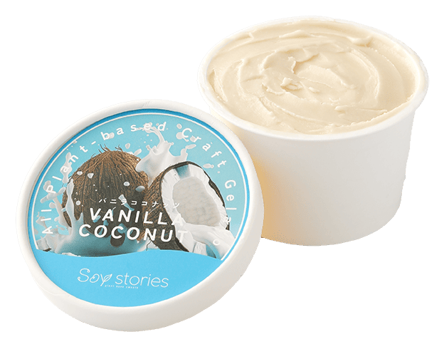 白い紙のカップにクリーム色のアイスクリームが入っている。その横には、ココナッツの写真と商品名が印刷されたカップアイスの蓋が置かれている。